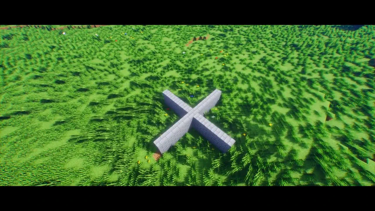 Two low stone walls crossing in a grass field, used as a shelter test